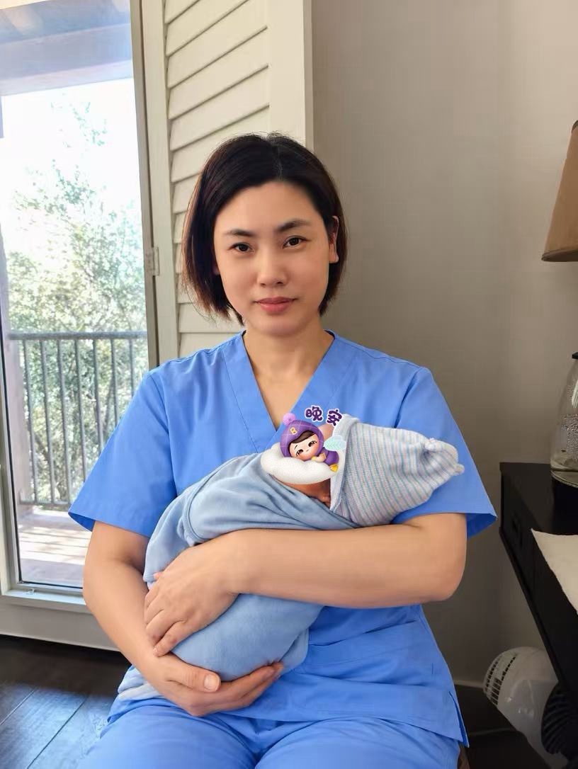 Ivy holding a newborn