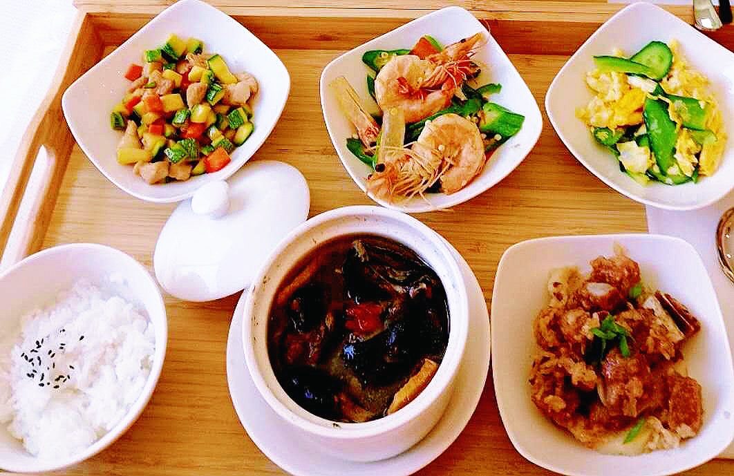 Postpartum meal tray with rice, soup and dishes